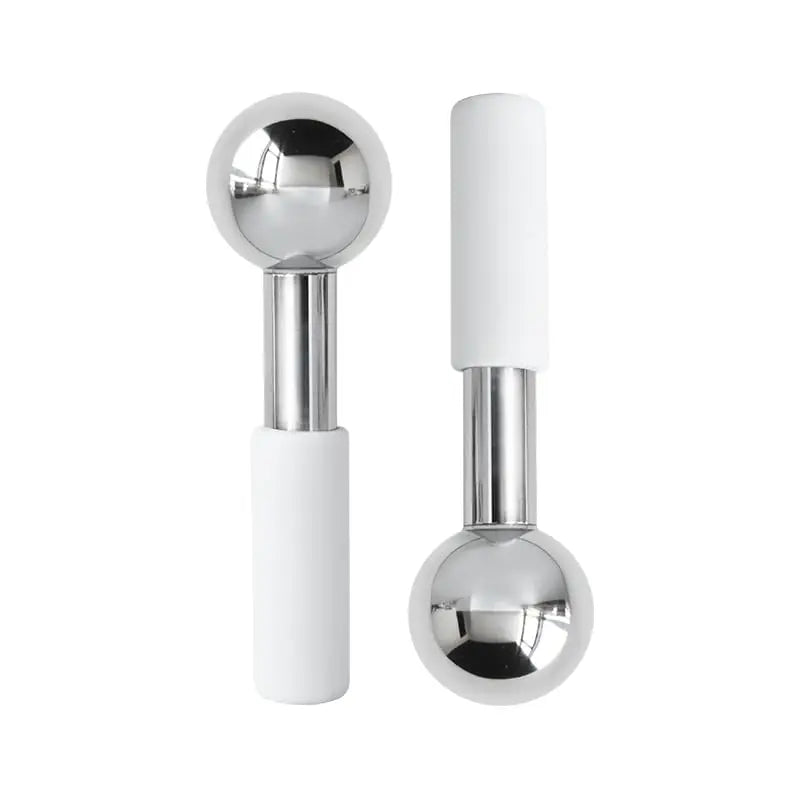 Stainless steel facial roller with white handle for at-home skincare massage and relaxation